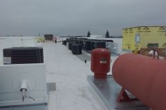 industrial equipment on a low slope roof taken by drone for safe inspections of inaccessible areas