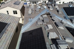 Close-up view of rooftops at various stages of construction