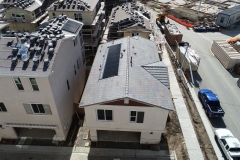 aerial view of multiple rooftops at different stages of construction