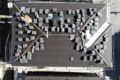 bird's eye view of rooftop with finish materials stacked all over it ready for installation